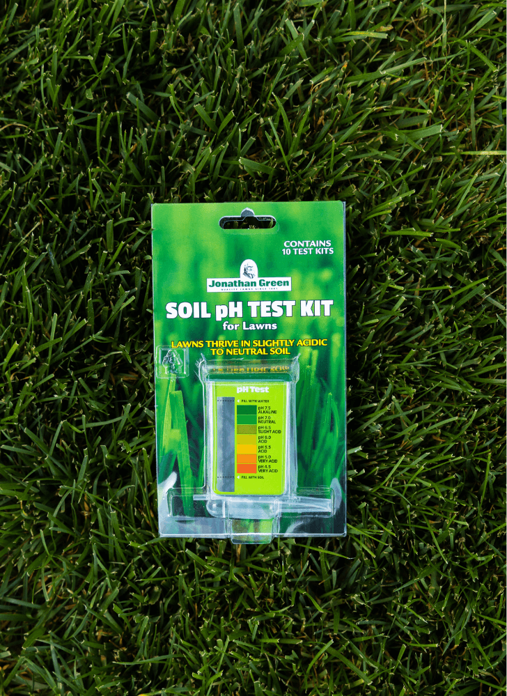 Soil pH Test Kit for Lawns by Jonathan Green, including test vials, displayed on a grassy background.
