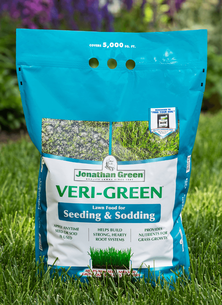 A bag of Jonathan Green Veri-Green Grass Seed & Fertilizer Bundle for Shady Lawns displayed on a grassy background.