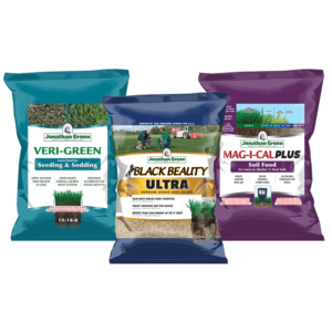 Three bags of Grass Seed & Fertilizer Bundle for Alkaline Soil: Seeding & Sodding, Black Beauty Ultra Grass Seed, and Mag-I-Cal Plus Soil Food for alkaline soil, arranged upright.