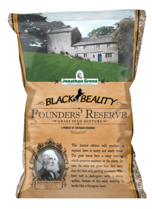 A bag of Black Beauty® Founders Reserve Grass Seed featuring a historic house and lawn, product details, and Jonathan Green’s portrait on the packaging.
