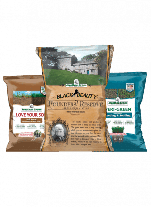 The Founders Reserve Lawn Care Bundle includes three key Jonathan Green products: a brown bag of soil food, a gold bag of grass seed mixture displaying a house illustration, and a blue bag of seeding and sodding fertilizer.