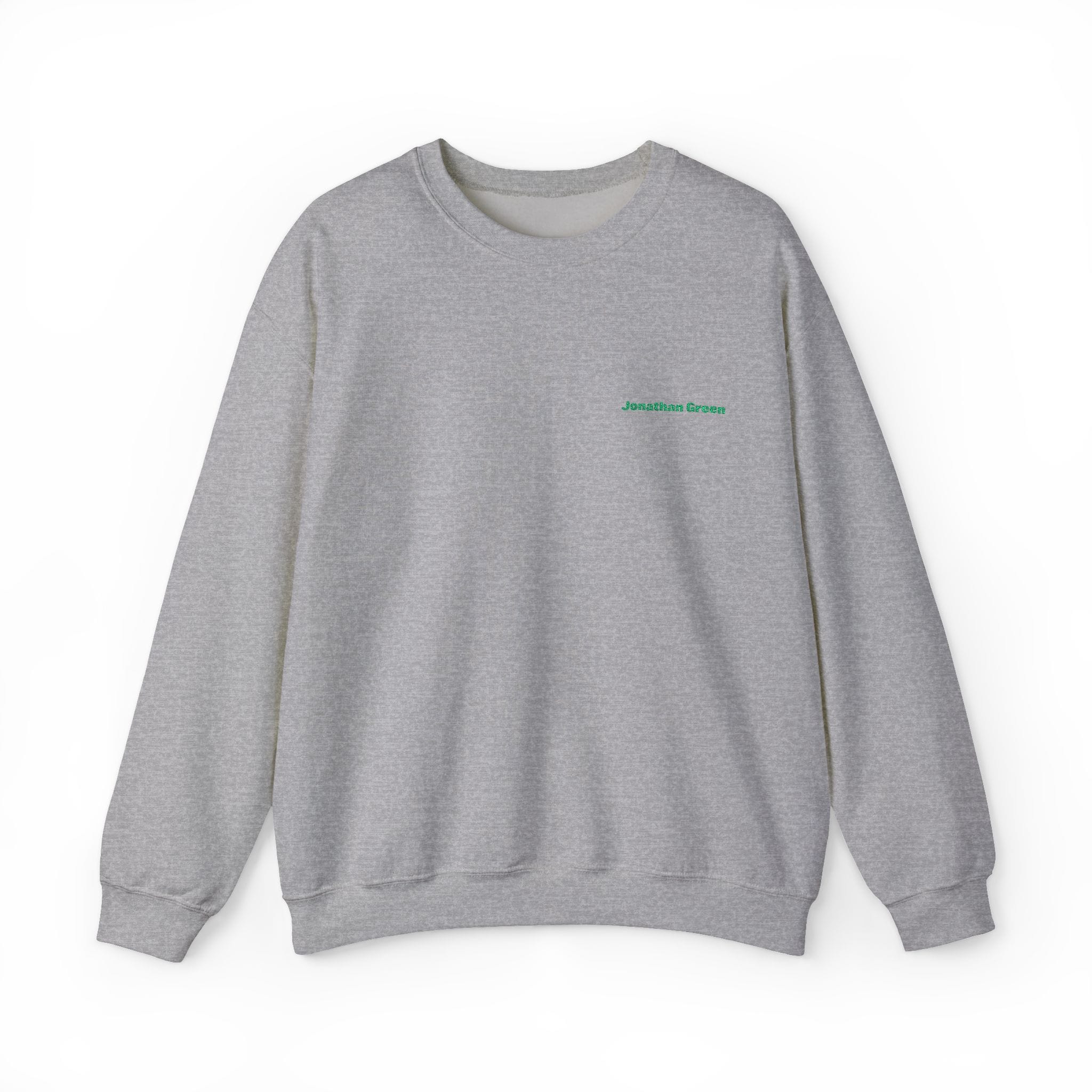 The JG Embroidered Heavy Blend™ Crewneck Sweatshirt is a plain gray crewneck featuring "Jonathan Green" embroidered in small green text on the upper left chest.