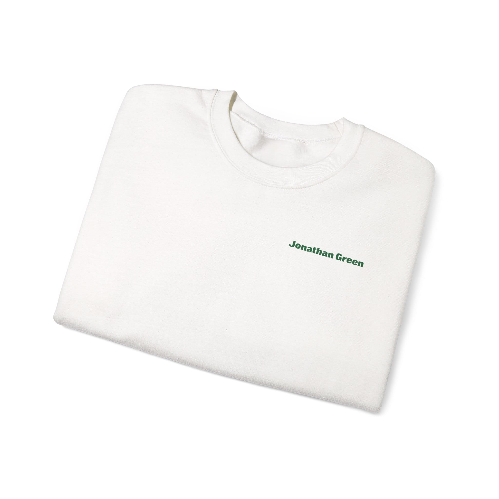 A folded white Sunday Lawn Club Heavy Blend™ Crewneck Sweatshirt with "Jonathan Green" printed in small green letters on the upper left chest.